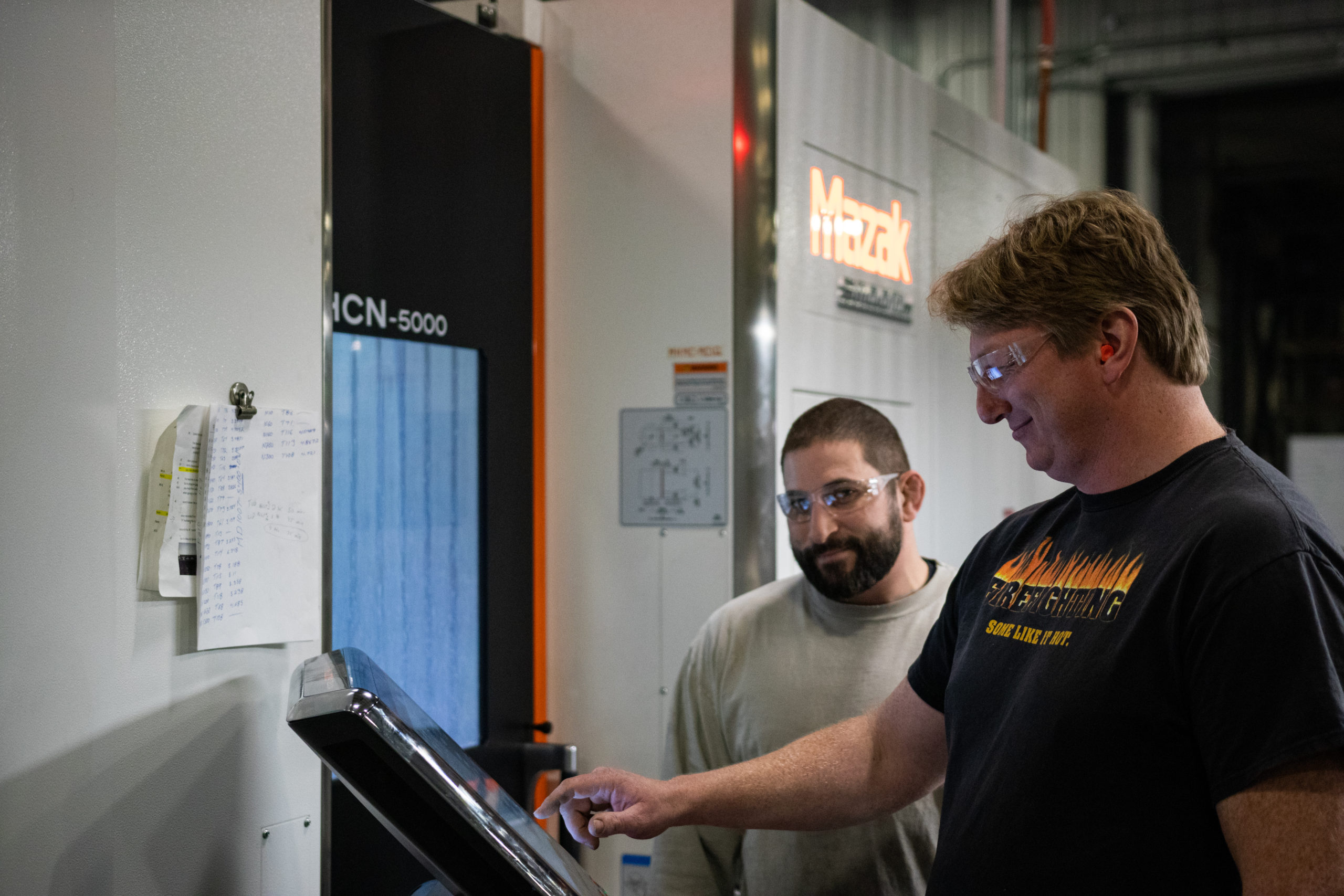 Employees on Mazak Machine